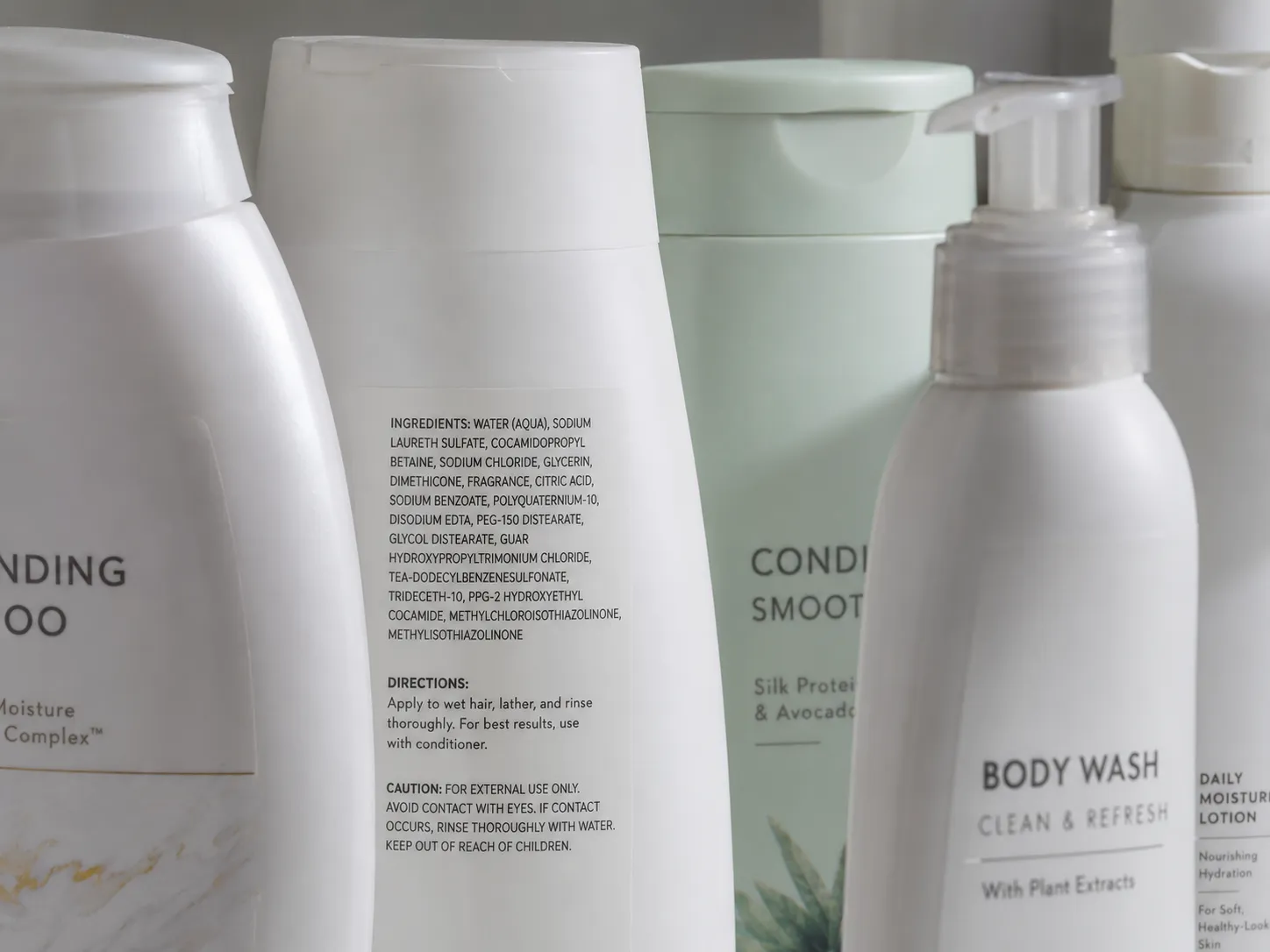 Personal care product bottles with fragrance labels